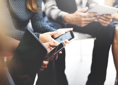 Group of people on tablet devices