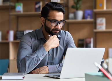 Male worker looking at laptop