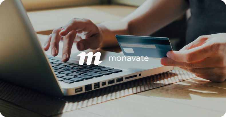 Person inputting card info into laptop with monavate logo overlay