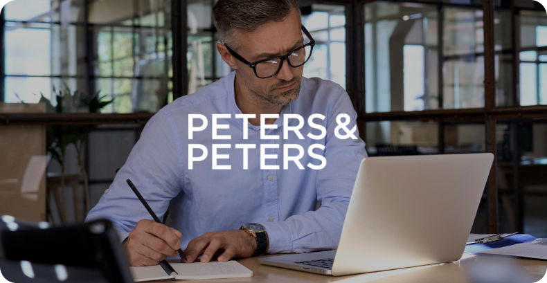 solicitor working on notes with Peters & Peters logo overlay