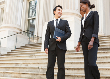 Colleagues having conversation on steps to building